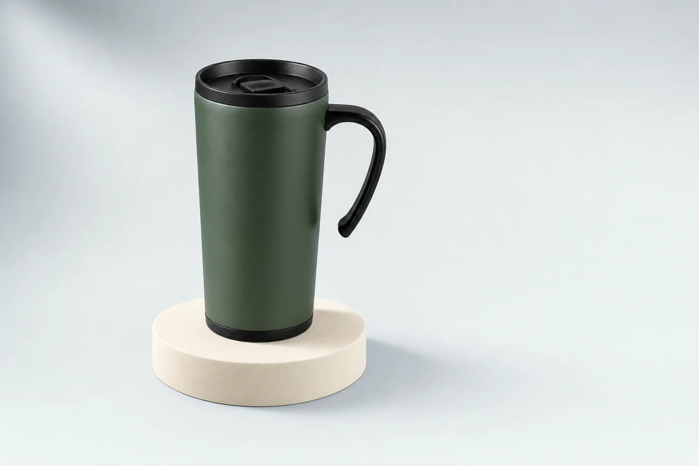 The same style of travel mug shown on a studio pedestal